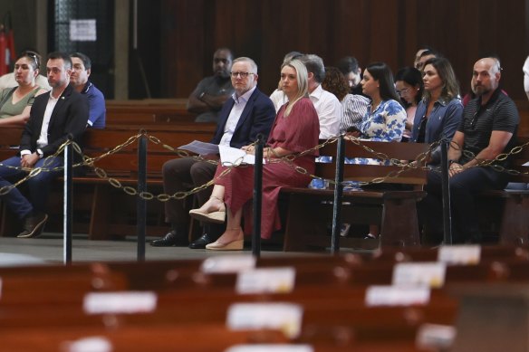 Prime Minister Anthony Albanese and his partner, Jodie Haydon, take their seats ahead of a service at the Metropolitan Cathedral of Saint Sebastian, in Rio de Janeiro, on Sunday. 