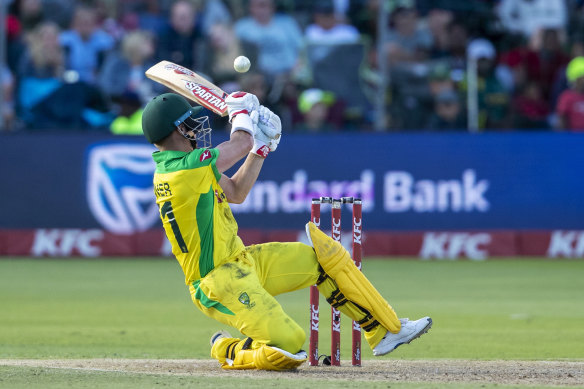 David Warner attempts a reverse swing during Australia's T20 cricket match against South Africa at St George's Park in Port Elizabeth on Sunday.