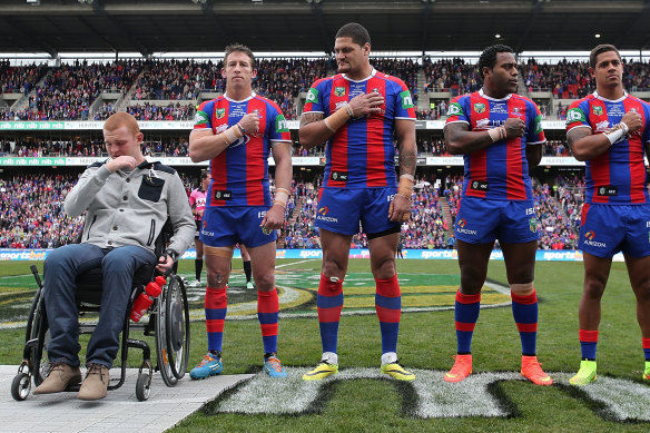 Knights players line up with Alex McKinnon (left) before the Rise for Alex Round in 2014.