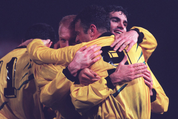 Arnold (number 9) being congratulated by Craig Foster and Robbie Slater after a goal against New Zealand in 1989.