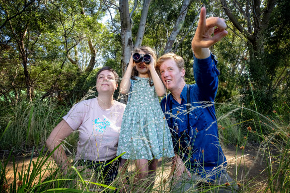 What's that bird? Audra Coxhill, 7,  with Melbirds authors Cindy Hauser and Michael Livingston at Trin Warren Tam-boore wetland in Royal Park. 