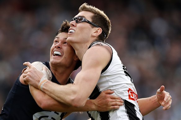 Jack Silvagni grapples with Mason Cox.