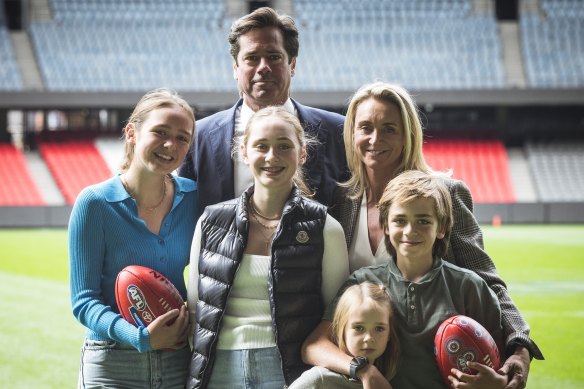 AFL chief Gillon McLachlan announces his plans to vacate the role, supported by his wife Laura and children Edie,14, Cleo, 12, Sidney, 8 and Luna 5.