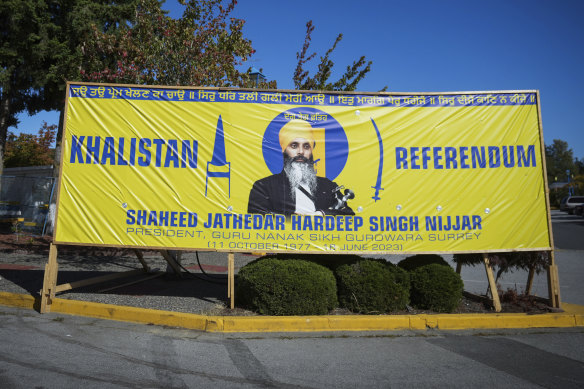 A photograph of the late Hardeep Singh Nijjar is seen on a banner outside the Guru Nanak Sikh Gurdwara Sahib in Surrey, British Columbia.