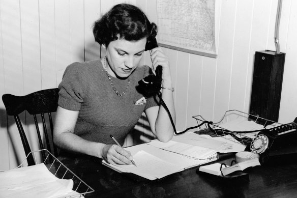An operator works the phones of Queensland’s Country Exchange Service in 1952.