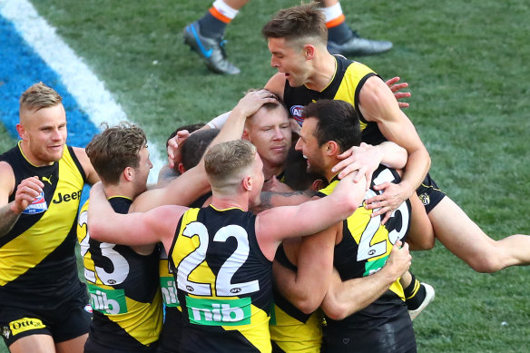 Jayden Short (top right) flies high after Richmond won the 2019 AFL flag. 