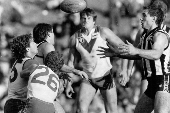 Greg Phillips, right, in action for the Pies in 1985.