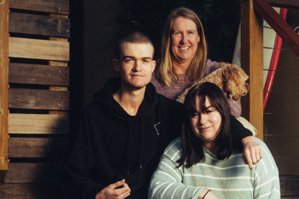 Rose Beaugeard – who pays 15 per cent of her salary to her parents while studying to be a doctor –  with her mother, Linda, brother Damien and dog Bailey.