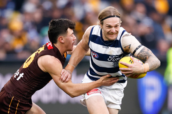 Tom Stewart breaks Massimo D’Ambrosio’s tackle on his way to a best on ground performance against Hawthorn.