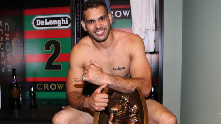 Driving force: Greg Inglis with the premiership trophy in 2014.