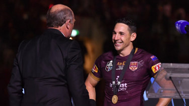 Controversial choice: Wally Lewis presents Billy Slater with the player of the series medal in 2018.