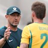 Tony Popovic greets Cameron Burgess after the match.