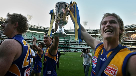 Adam Selwood (right) with the AFl Premiership Cup following West Coast’s 2006 win.