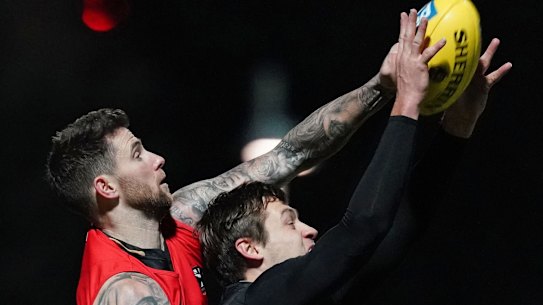 Jeremy Howe and Darcy Moore compete at  training on Friday night.