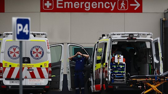 Ambulance paramedics at the Nepean Hospital cleaning and restocking vehicles in preparation for a call on Sunday.