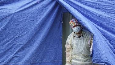 A medical worker at a COVID-19 mobile testing site in the Brooklyn borough of New York.