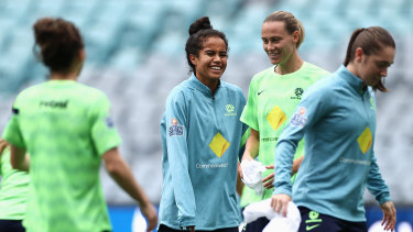 Mary Fowler shares a laugh with teammates at training on Friday.
