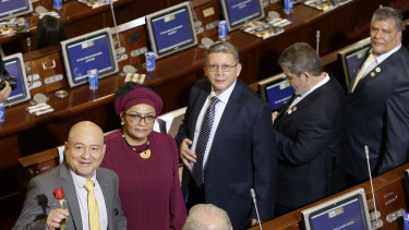 From left, Carlos Lozada, Victoria Sandino, Pablo Catatumbo, Marco Calarca and Olmedo Ruiz, all former members of the demobilised FARC arrive at Congress to take up their seats in Bogota on Friday.