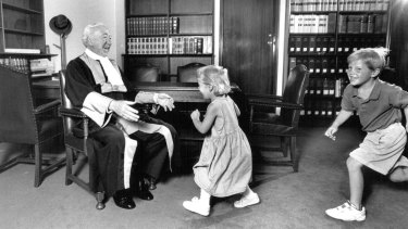 Judge Staunton with his grandchildren Kate and Jamie in his chambers on the day he retired, aged 72, in 1994.
