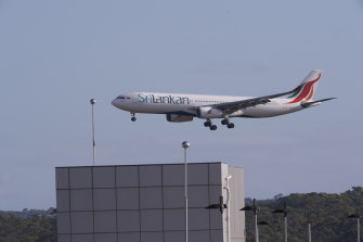 The SriLankan Airlines flight carrying the first international travellers from outside New Zealand in five months landed at Melbourne Airport on Monday morning.