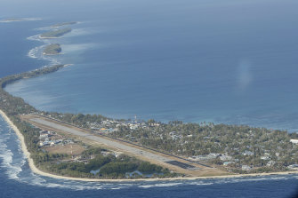 Funafuti, the main island of the nation state of Tuvalu, from the air. Only four Pacific island nations, including Tuvalu, were represented by their leaders at COP26, in Glasgow because of COVID-19 travel restrictions. 