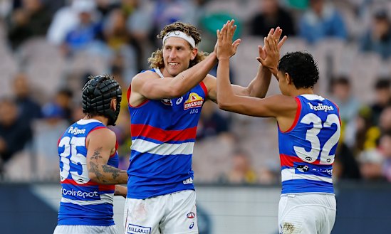 Aaron Naughton’s under-18s state coach Peter Sumich thinks he will serve the Bulldogs better as a key defender.