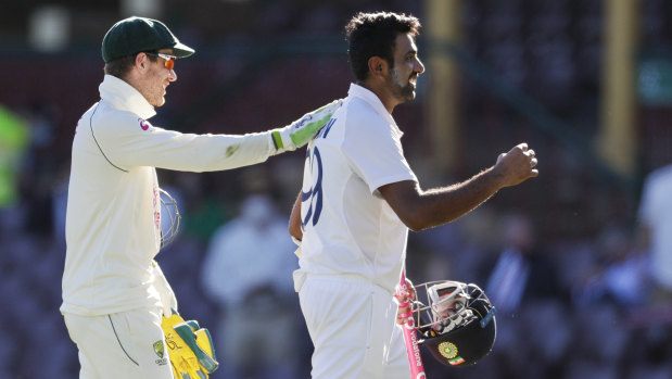 Tim Paine congratulates Ravi Ashwin at stumps.