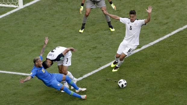 Brazil's Neymar takes a tumble and was awarded a penalty that was later reversed.