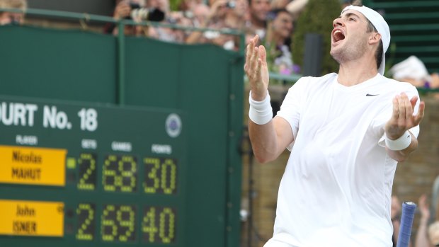 John Isner reacts after his epic victory over Nicolas Mahut at Wimbledon in 2010.