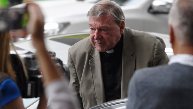 Cardinal George Pell arrives at Melbourne Magistrates Court for the final day of a four-week pre-trial hearing on historical sexual assault allegations.