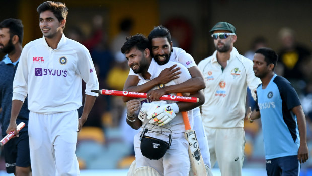 Rishabh Pant celebrates victory in Brisbane with his teammates.