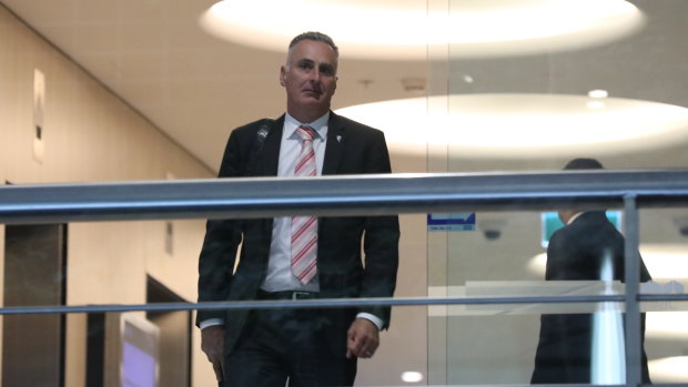 NSW MP John Sidoti leaving the ICAC on Tuesday. In the witness box Mr Sidoti blamed a poor choice of words in a third email to councillors accusing council staff of being misleading “to sell the business community of Five Dock a pup”.