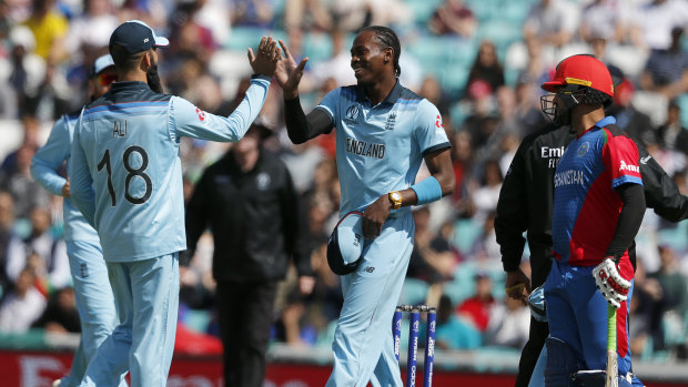 Jofra Archer, centre, took three wickets in England's warm-up clash with Afghanistan.