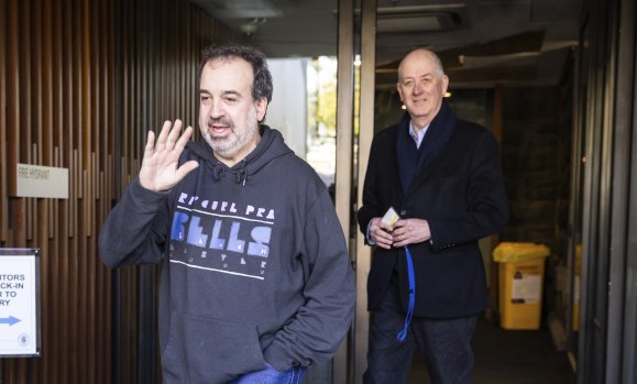 Outgoing tourism, sport and major events minister Martin Pakula (left) leaves Saturday’s caucus meeting.