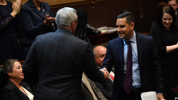 Independent MP Alex Greenwich shakes hands with Health Minister Brad Hazzard after introducing the Reproductive Healthcare Reform Bill.