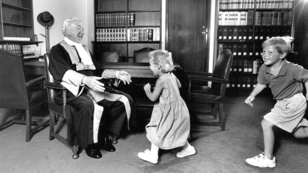 Judge Staunton with his grandchildren Kate and Jamie in his chambers on the day he retired, aged 72, in 1994.