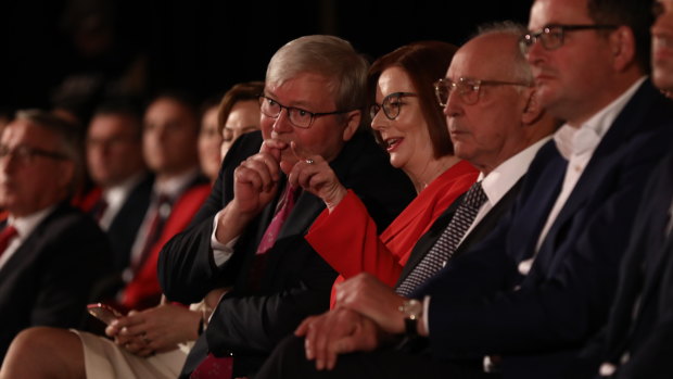 Former prime ministers Rudd and Gillard share a laugh.
