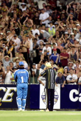 Shane Warne, with Mark Waugh’s helmet on, pleads with the MCG crowd.