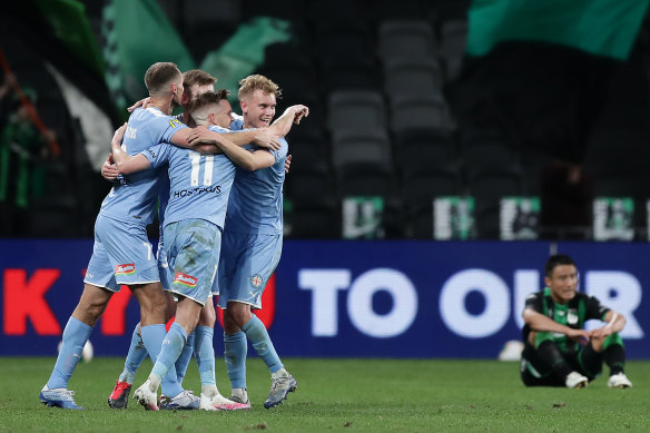 Melbourne City celebrate winning through to the A-League grand final.