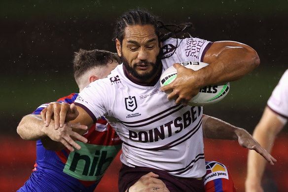 Manly’s Marty Taupau on the charge in Newcastle on Thursday night.
