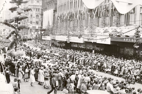 Crowds outside the Myer store, in Bourke Street, Melbourne, at Christmastime in 1956.