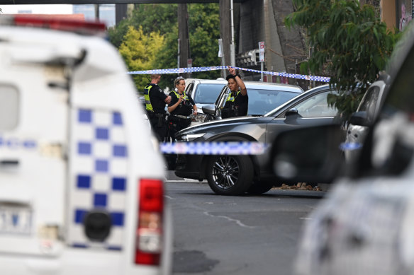 Police at the scene where a woman was killed on April 5.