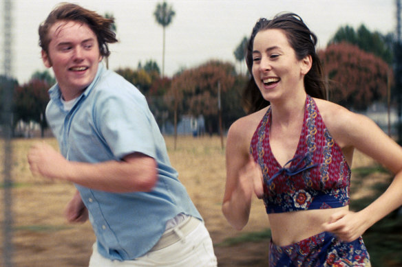 Cooper Hoffman, left, and Alana Haim in a scene from Licorice Pizza.