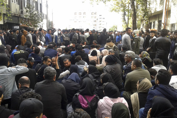 Protesters attend a demonstration after authorities raised gasoline prices, in the northern city of Sari, Iran, on Saturday.