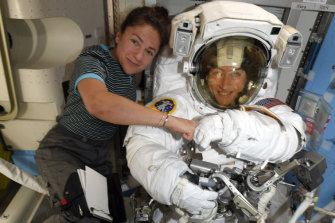Christina Koch and Jessica Meir pose ahead of their spacewalk. They had to wait for suits that fitted them. 