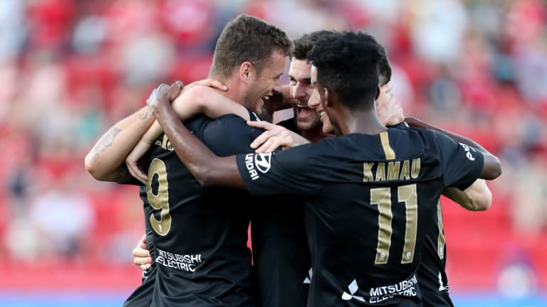 Second time lucky: Oriol Riera celebrates his opener with teammates.