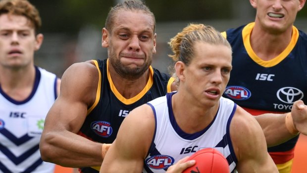 Nat Fyfe takes on Adelaide in a community match earlier this year.