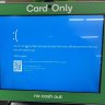 An self-checkout register at Woolworths displays a blue screen as companies nationwide report IT outages.
