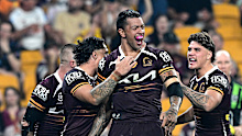 Xavier Willison of the Broncos celebrates after scoring a try.