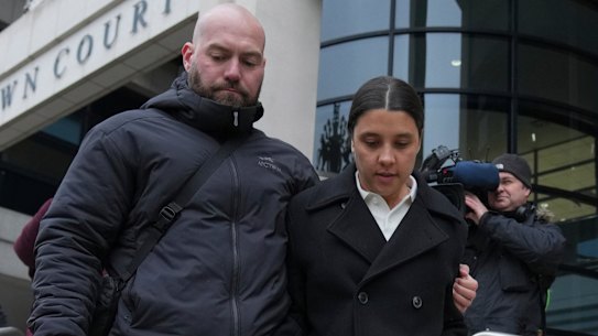 Australian soccer player Samantha Kerr, right, departs Kingston Crown Court, in south west London, Tuesday, Feb. 11, 2025, where she is was found not guilty on charges of alleged racially aggravated harassment of a police officer. (AP Photo/Kin Cheung)
